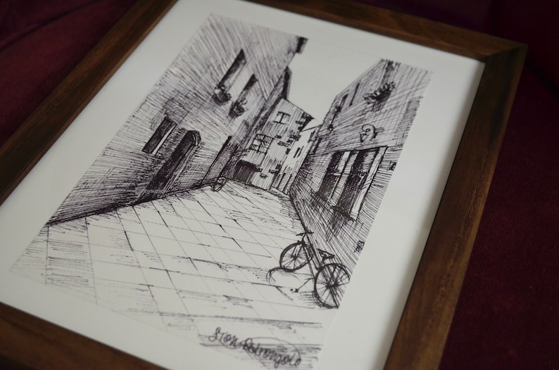 May include: Black and white ink drawing of a narrow street with buildings on either side. A bicycle is parked in the street. The drawing is signed "Sten Stromberg".