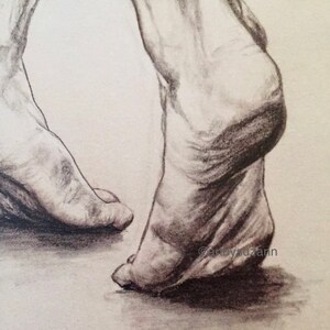 May include: A close-up of two bare feet, drawn in pencil on paper. The feet are angled towards each other, with the toes of the right foot pointing towards the left foot. The drawing is detailed and realistic, showing the contours of the feet and the texture of the skin.
