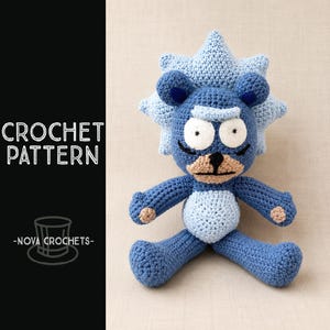 May include: A crochet pattern for a stuffed toy featuring a blue character with a spiky light blue hair halo, large white eyes, a tan muzzle, and a black nose. The text CROCHET PATTERN and NOVA CROCHETS with a top hat icon appear on the left side.