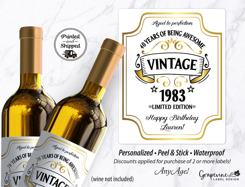 May include: Two gold wine bottle labels with a white background and gold text. The labels say "Aged to perfection 40 years of being awesome Vintage 1983 Limited Edition Happy Birthday Lauren!" and "Personalized. Peel & Stick. Waterproof. Discounts applied for purchase of 2 or more labels! Any Age!"