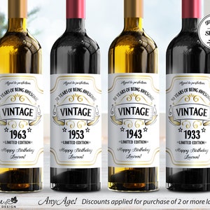 May include: Four wine bottle labels with a vintage design. The labels are white with gold accents and feature the text "Vintage" and a year. The years are 1963, 1953, 1943, and 1933. The labels also include the text "Limited Edition" and "Happy Birthday Lauren!"