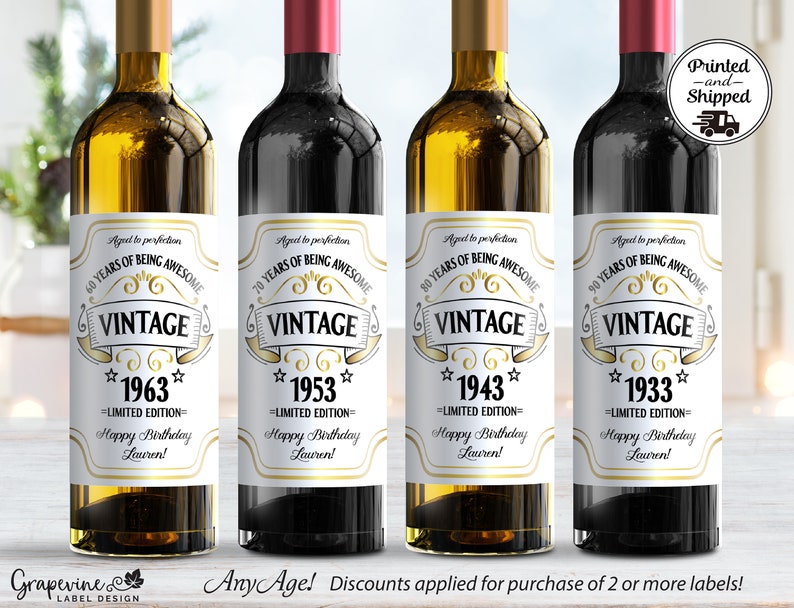 May include: Four wine bottle labels with a vintage design. The labels are white with gold accents and feature the text "Vintage" and a year. The years are 1963, 1953, 1943, and 1933. The labels also include the text "Limited Edition" and "Happy Birthday Lauren!"