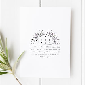 May include: White art print featuring a hand-drawn illustration of a building with floral accents. The print includes the text "See if I will not throw open the floodgates of heaven...Malachi 3:10."
