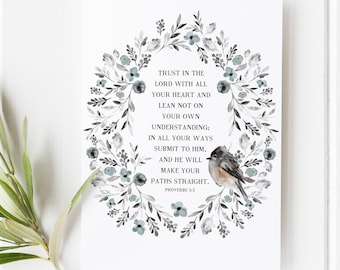 May include: A watercolor print with a floral wreath and a small bird. The print features the Bible verse Proverbs 3:5, "Trust in the Lord with all your heart and lean not on your own understanding: In all your ways submit to him, and he will make your paths straight."