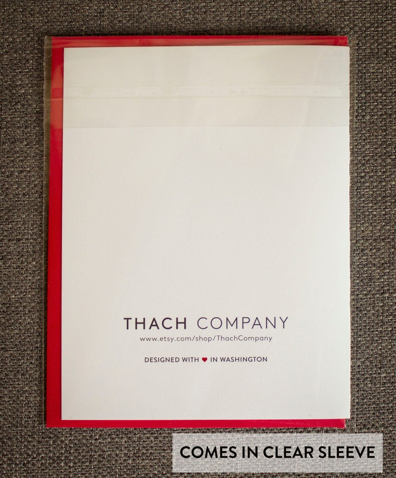 May include: A white card with red edging, featuring the text "THACH COMPANY" in black, followed by the website address "www.etsy.com/shop/ThachCompany". Below this, it reads "DESIGNED WITH &hearts; IN WASHINGTON". The card is in a clear plastic sleeve.