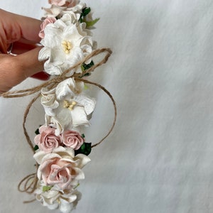 Delicate blush roses and ivory blossoms designed for timeless, neutral outfits and keepsake photos