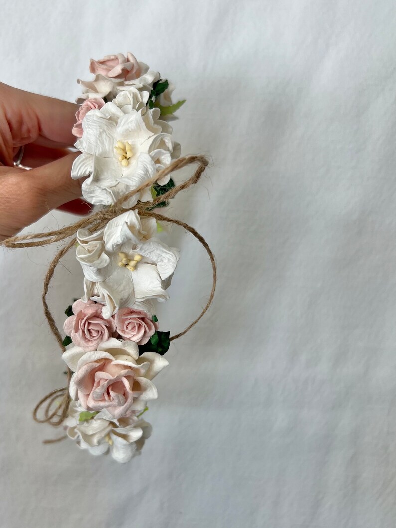 Delicate blush roses and ivory blossoms designed for timeless, neutral outfits and keepsake photos