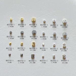 May include: A collection of small, metallic stud earrings in various shapes, including round, square, and X-shaped designs. The earrings are in gold and silver tones, with sizes ranging from 1mm to 3.5mm.
