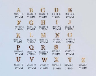 100 sztuk Złote Miękkie Metalowe Części Nail Art Metalowe nieprzylepne naklejki Metalowe Plastry Różne Litery Alfabetu MS541-566