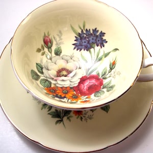 Royal Grafton Tea Cup and Saucer, Yellow Tea Cup and Saucer with Flowers.