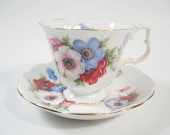 Royal Albert Tea Cup and Saucer, White with Pink, White and Blue Flowers tea cup and saucer set.