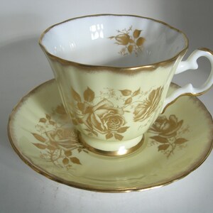 Royal Grafton Yellow Tea Cup And Saucer, Gold roses on Yellow tea cup, Heavy Brushed Gold Rims.