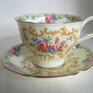 Paragon  Tea cup And Saucer, Yellow Teacup set with flowers, Minuet tea cup and saucer set.