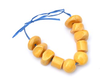 10 pieces of HandMade Ceramic Medium  Beads in Various Shapes  in Soft Yellow as shown on the pictures