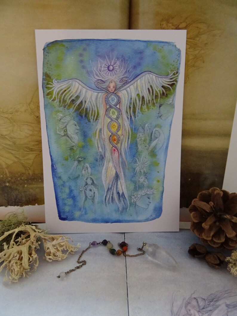 May include: A watercolor painting of a winged figure with a halo, surrounded by other figures. The central figure has a rainbow-colored column of energy running down its body, representing the seven chakras.