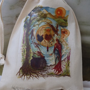 May include: A white cotton drawstring bag with a colorful illustration of a woman standing in a forest with a cauldron, a tree, and a sun. The bag has the text "FREE RANGE FAERIES" and "artwork by Kate Monkman" printed on it. The text "www.freerangefaeries.co.uk" is also printed on the bag.
