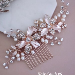 May include: A rose gold hair comb with floral and pearl detailing. The comb features two large flower designs with crystal centres and smaller crystals and pearls. The text "Hair Comb #6" is at the bottom.