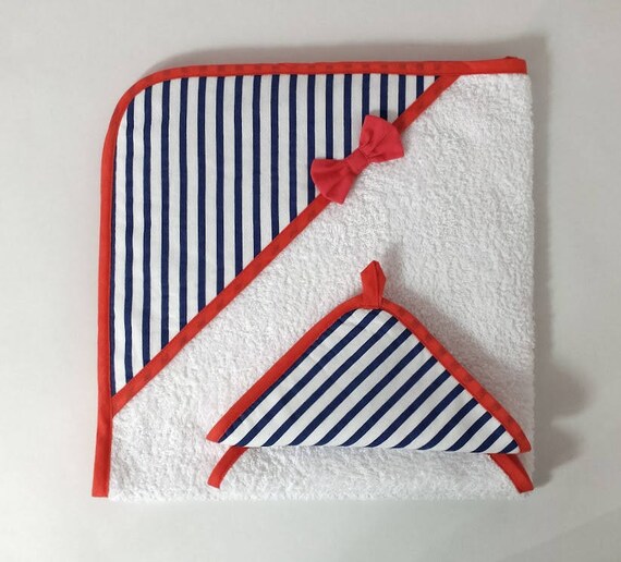 coral and white bath towels