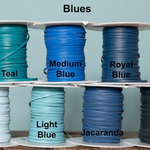 May include: Spools of leather cord in various shades of blue, including teal, sky blue, light blue, medium blue, royal blue, jacaranda, and navy. The spools are labeled with the color names.