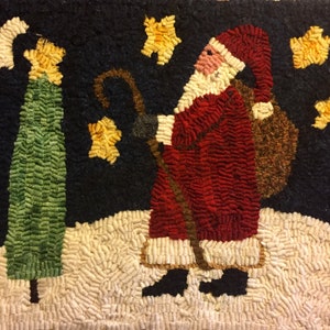 May include: A hand-stitched wool rug depicting Santa Claus carrying a bag of gifts, walking past a green Christmas tree under a starry night sky.