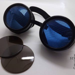 May include: Black steampunk goggles with blue mesh lenses and a black headband. Two additional black lenses are included.