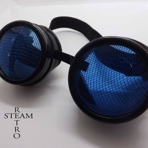May include: Black steampunk goggles with blue mesh lenses. The goggles have a round frame and a black adjustable strap.