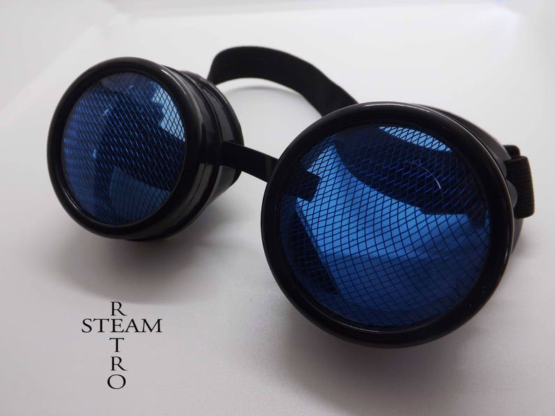 May include: Black steampunk goggles with blue mesh lenses. The goggles have a round frame and a black adjustable strap.
