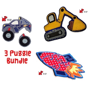 May include: A set of three felt puzzles: a blue monster truck, a yellow excavator, and a red and blue rocket. The rocket has a star pattern. The text "3 Puzzle Bundle" is in red.