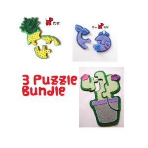 May include: A set of three felt puzzles for children. The puzzles include a pineapple, a whale, and a cactus in a pot. The puzzles are made of felt and have a soft, fuzzy texture. The puzzles are perfect for toddlers and preschoolers.