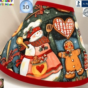 May include: A red and white Christmas tree skirt with a snowman, gingerbread man, and heart design. The skirt is made of fabric and has a red trim. The text "Copyright Protected" is visible on the skirt.
