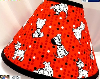 May include: Red lampshade with a black trim and a white polka dot pattern. The lampshade features a repeating pattern of Dalmatian puppies.