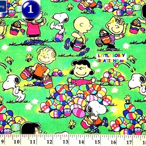May include: Green fabric with a repeating pattern of Peanuts characters, including Snoopy, Charlie Brown, and Lucy, holding Easter baskets and eggs. The fabric also features a number "1" in a blue circle.