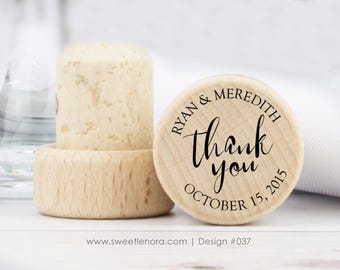 May include: Wooden bottle stopper with a round, engraved top that says "Ryan & Meredith thank you October 15, 2015".