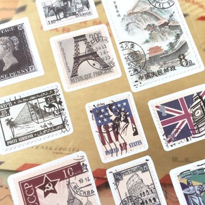 May include: A sheet of vintage-style postage stamp stickers featuring iconic landmarks from around the world, including the Eiffel Tower, the Great Wall of China, Big Ben, and the Statue of Liberty.