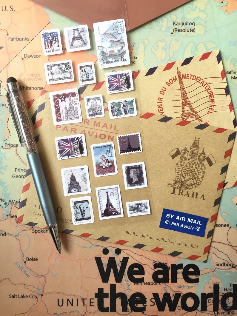 May include: A brown paper envelope with a red and blue striped border. The envelope has a stamp with a drawing of the Eiffel Tower and the text "VENIR DU SOM METDELATOUREIF TRAHA BY AIR MAIL 航 PAR AVION 空". The envelope is decorated with various postage stamps featuring landmarks from around the world. The text "We are the world" is printed on a map below the envelope.
