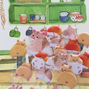 May include: A collection of colorful, cartoon hamster stickers. The hamsters are in various poses, including sitting, standing, and running. The stickers are perfect for adding a touch of whimsy to any project.
