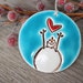 Handmade Snowman with Heart Ceramic Christmas Ornament, Artisan Crafted North Pole Theme, Red and Blue Whimsical Winter Decoration