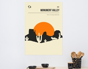 May include: A minimalist poster with a beige background featuring a black silhouette of a desert landscape with a setting sun. The text "VISIT MONUMENT VALLEY" is at the top of the poster, and the text "There is in this valley a beating heart" is below the landscape.