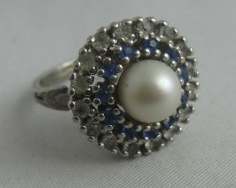 Glamorous, old cocktail ring with precious pearl, sapphires and zircons (or rock crystals) made of silver (800 Ag). Vintage jewelry