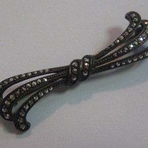 Marcasite loop. Ancient silver brooch (835 Ag). Vintage
