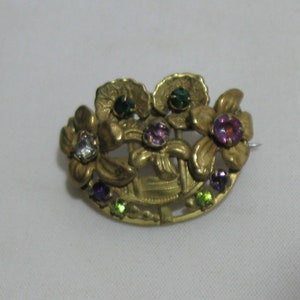 Gorgeous metal brooch with different colored stones. Probably around 1900. VINTAGE
