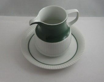 Rosenthal Germany studio line. Modulation, secunda green. Design Tapio Wirkkala. Milk jug and saucer. 1960s porcelain. VINTAGE