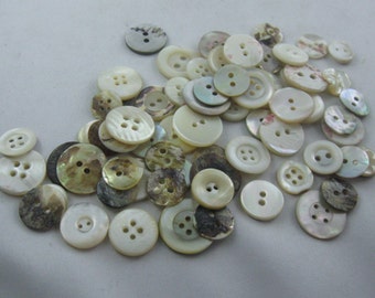 MOTHER OF PEARL BUTTONS. Small bag (50 grams) of old, used, real mother-of-pearl buttons. Shape: Round. Various sizes. Hole Buttons. VINTAGE