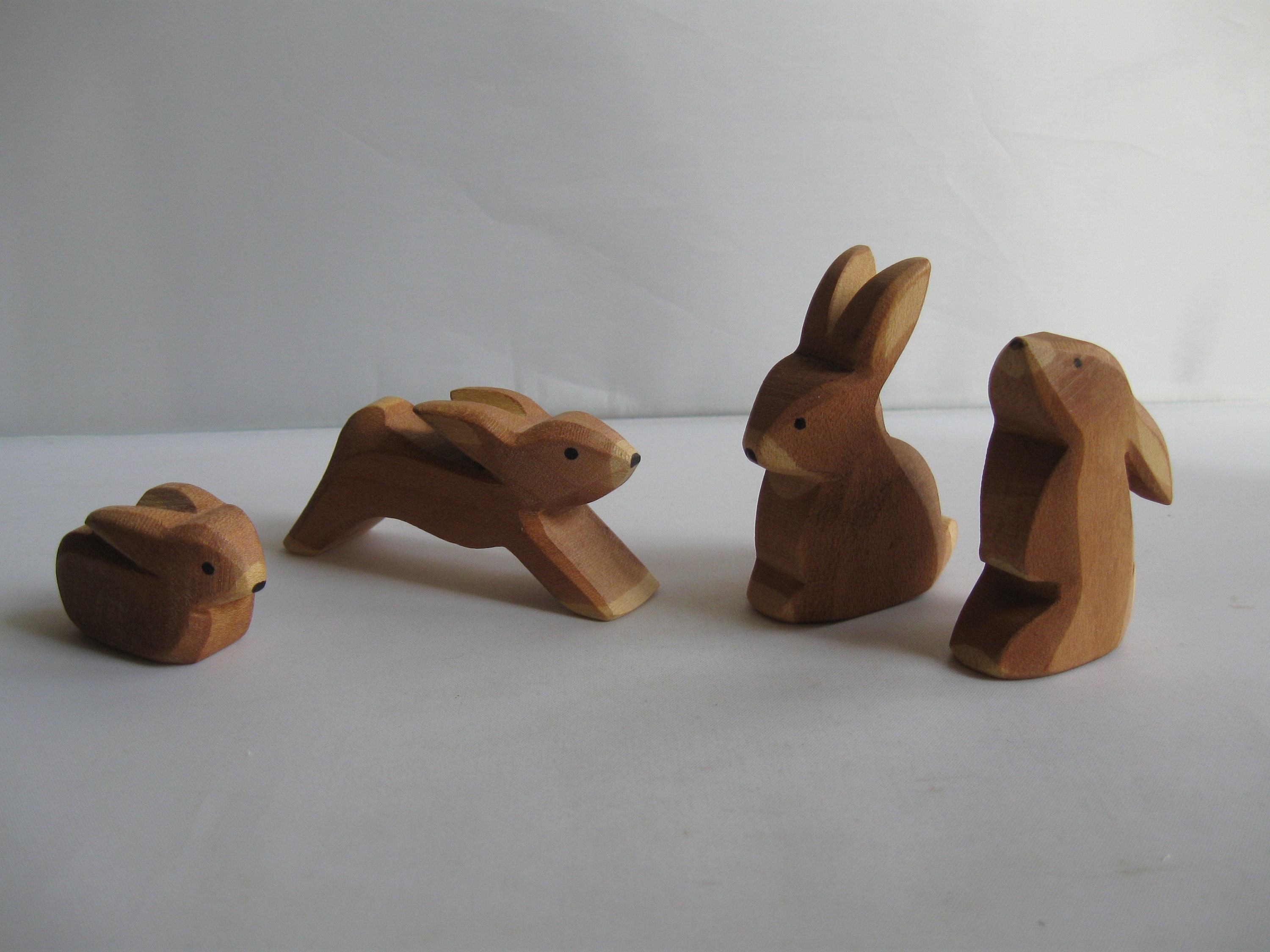 1990s wooden figures / wood animals. Wooden toys. Animals in the forest and field: hare / rabbit family consisting of 4 bunnies. Vintage
