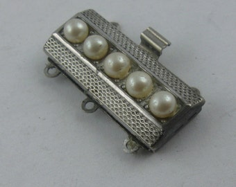 Elegant jewelry clasp for 3-row necklace of silver (Ag 835) with (artificial) pearls. Jewelry accessories. Vintage