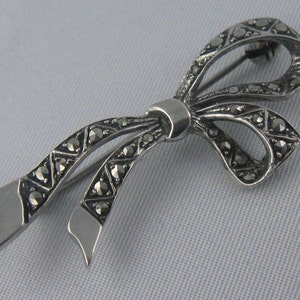 Marcasite loop. Ancient silver brooch (835 Ag). Vintage