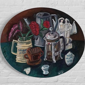 May include: An oil painting on a round canvas depicts a still life with a coffee press, a mug with text, a teapot, and red flowers. The color palette includes shades of brown, green, and white.