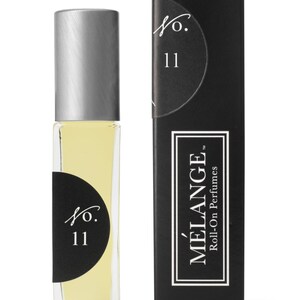Könnte beinhalten: Eine schwarze und silberne Roll-on-Parfümflasche mit einem schwarzen Etikett, auf dem "No. 11" und "MELANGE Roll-On Perfumes" steht.