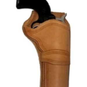 May include: A tan leather holster for a revolver. The holster has a flap that covers the top of the gun and a belt loop on the back.
