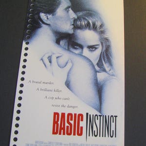 May include: A movie poster for "Basic Instinct" featuring Michael Douglas and Sharon Stone. The poster has a white background with the title in red and black. Text includes "A brutal murder. A brilliant killer. A cop who can't resist the danger."